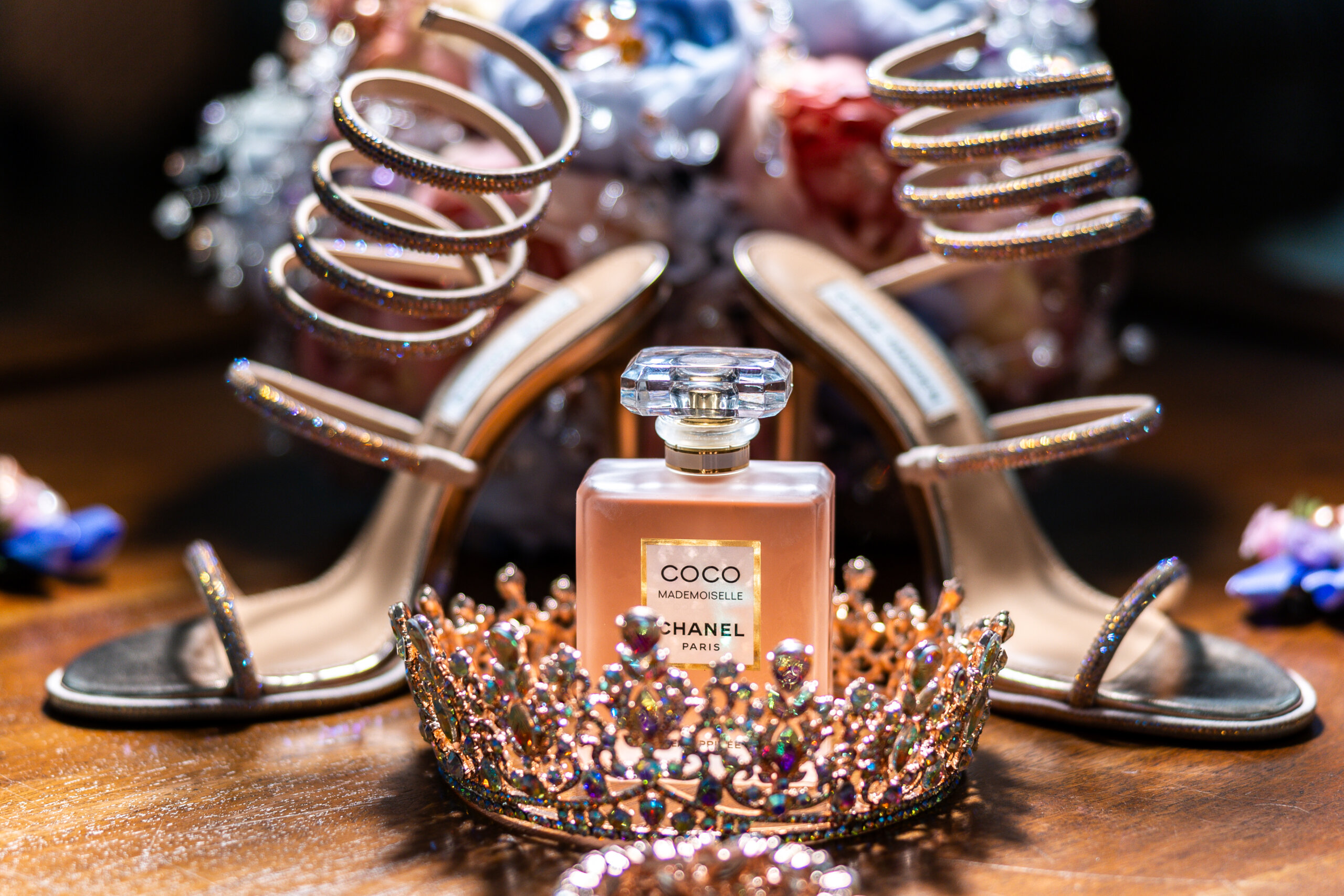 Detail shot of quinceañera tiara, heels, and perfume with warm lighting – Cabrera Photography Quinceañera